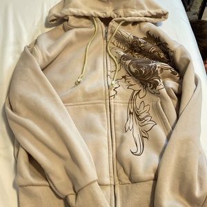 Beige zip up sweater with brown patterns